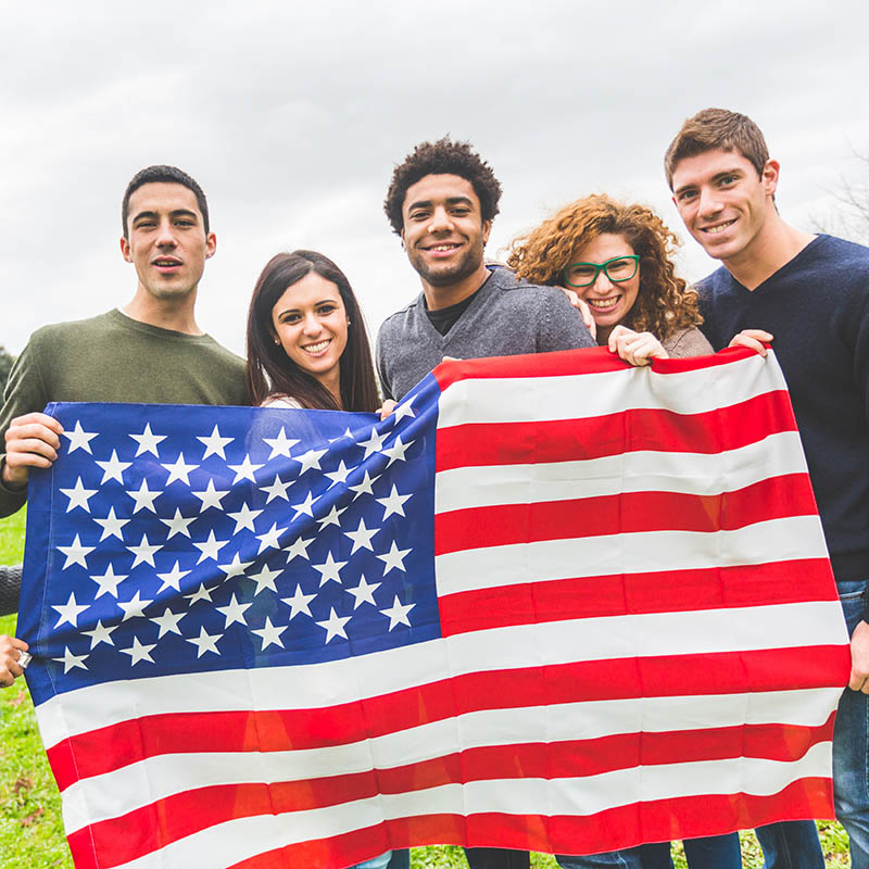 Young adults with an American flag Young adults with an American flag